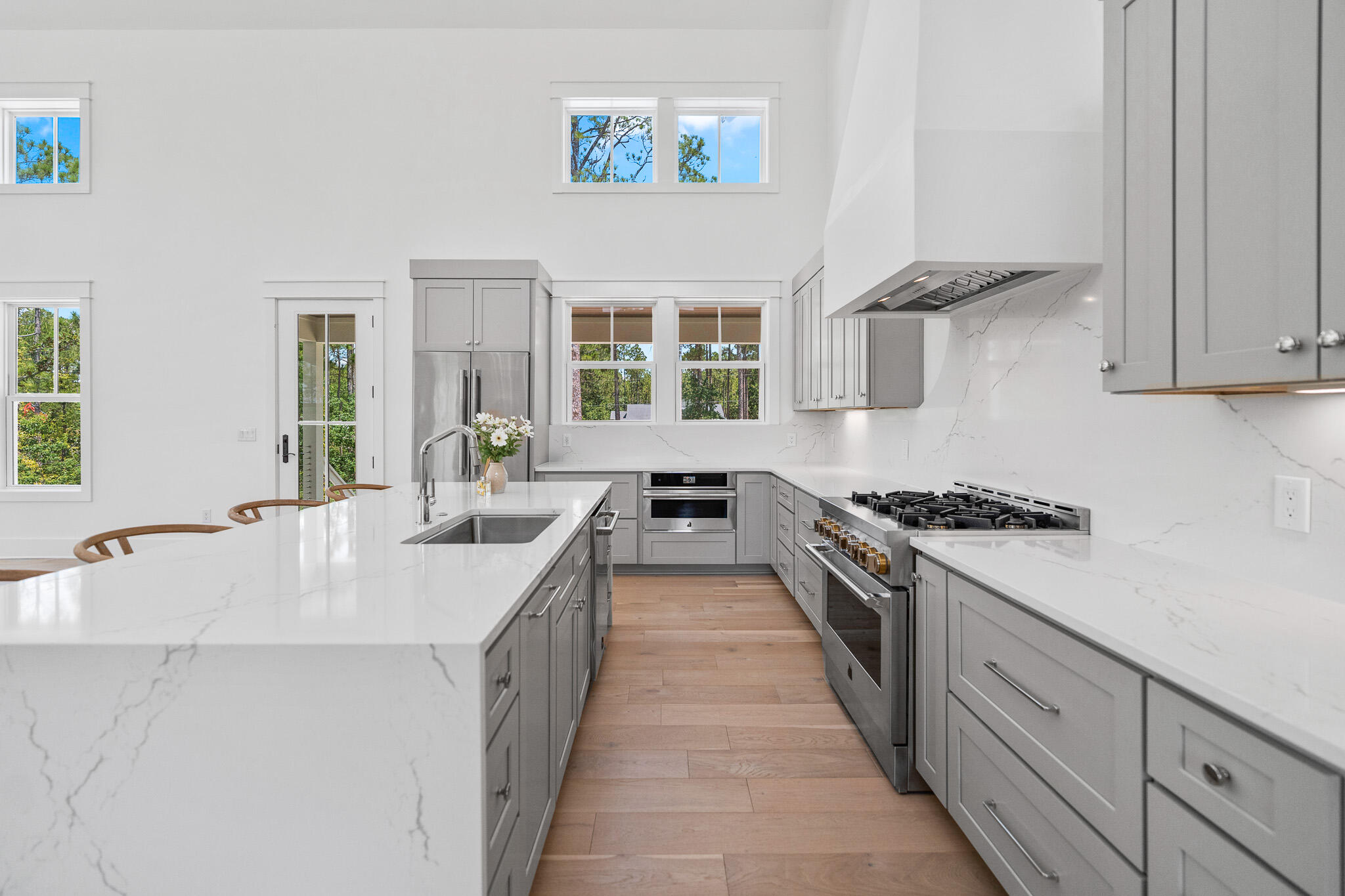 121 West Nursery Road Santa Rosa Beach, FL 32459 - Photo 20 of 66 a large white kitchen with a large window
