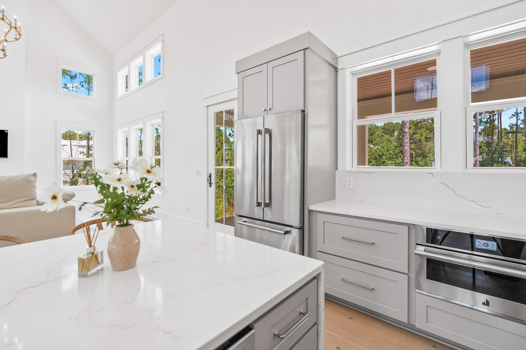 121 West Nursery Road Santa Rosa Beach, FL 32459 - Photo 22 of 66 a kitchen with a refrigerator and a white cabinets