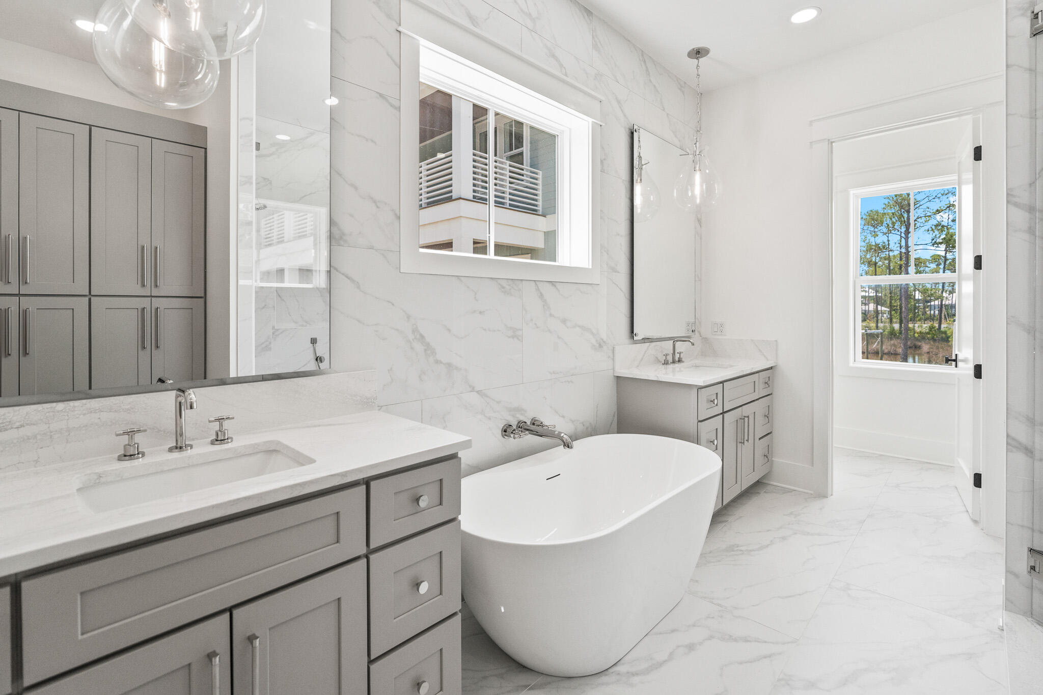 121 West Nursery Road Santa Rosa Beach, FL 32459 - Photo 34 of 66 a bathroom with a sink double vanity and a mirror