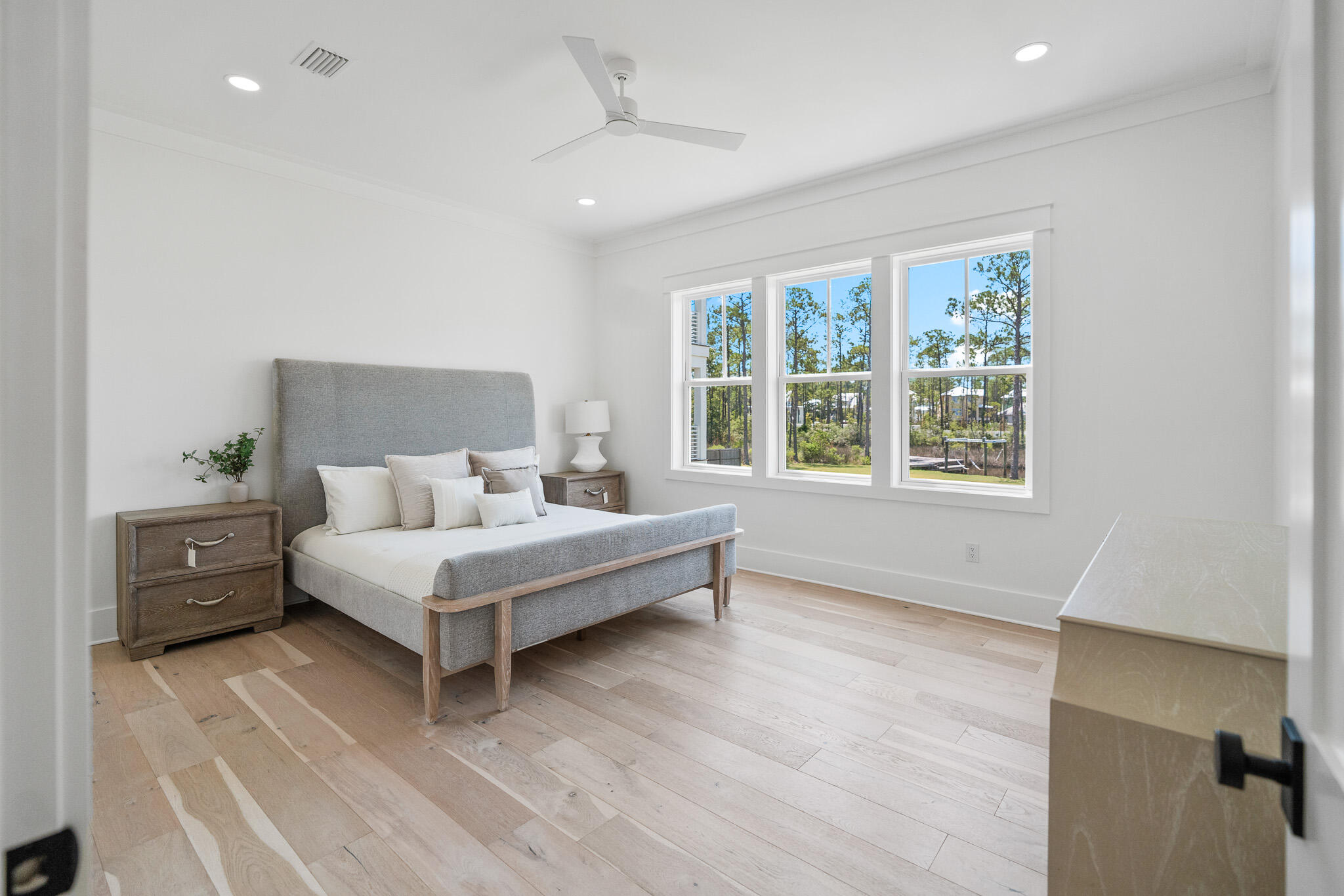 121 West Nursery Road Santa Rosa Beach, FL 32459 - Photo 37 of 66 a white bed sitting in a room next to a window