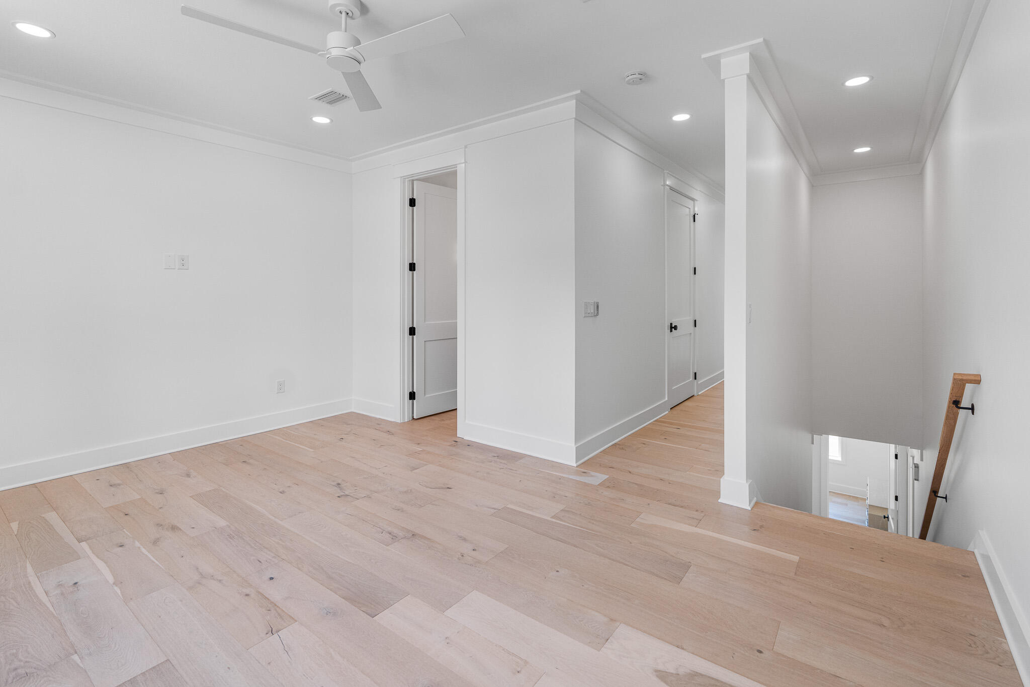 121 West Nursery Road Santa Rosa Beach, FL 32459 - Photo 46 of 66 a view of a hallway with wooden floor
