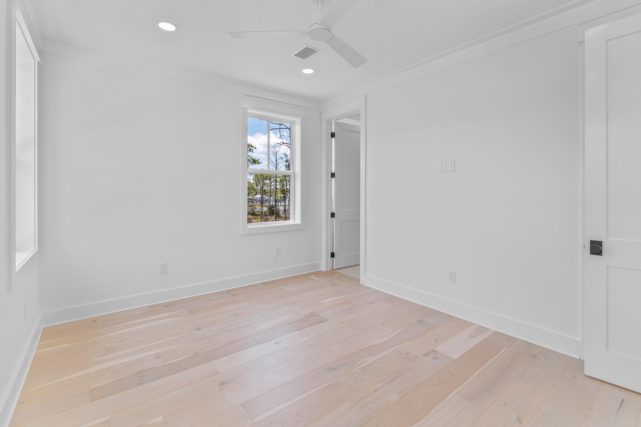 121 West Nursery Road Santa Rosa Beach, FL 32459 - Photo 53 of 66 an empty room with windows and closet