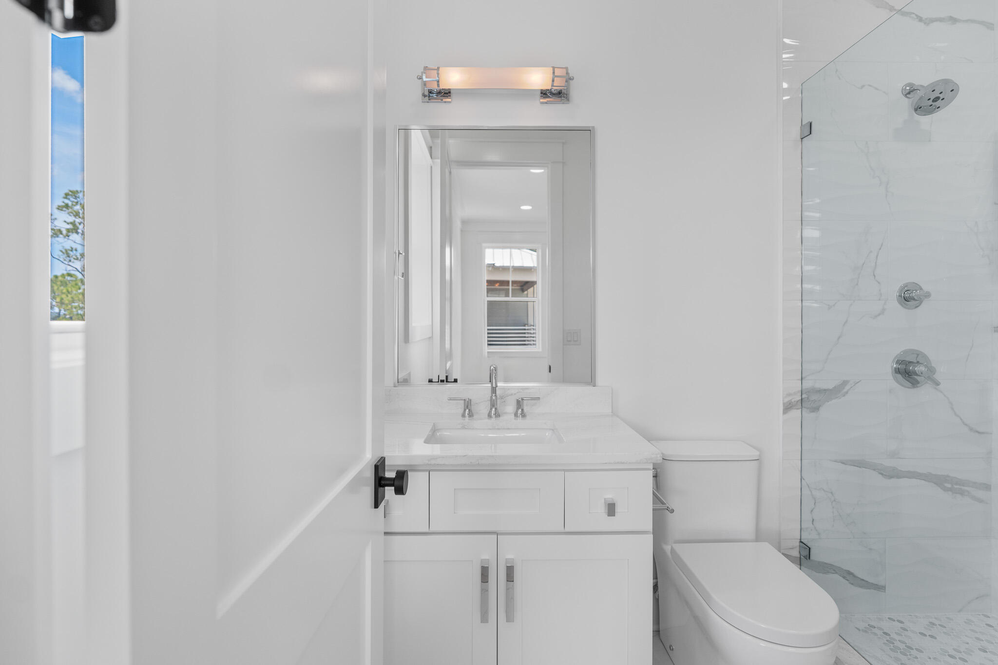 121 West Nursery Road Santa Rosa Beach, FL 32459 - Photo 54 of 66 a bathroom with a sink toilet vanity and shower