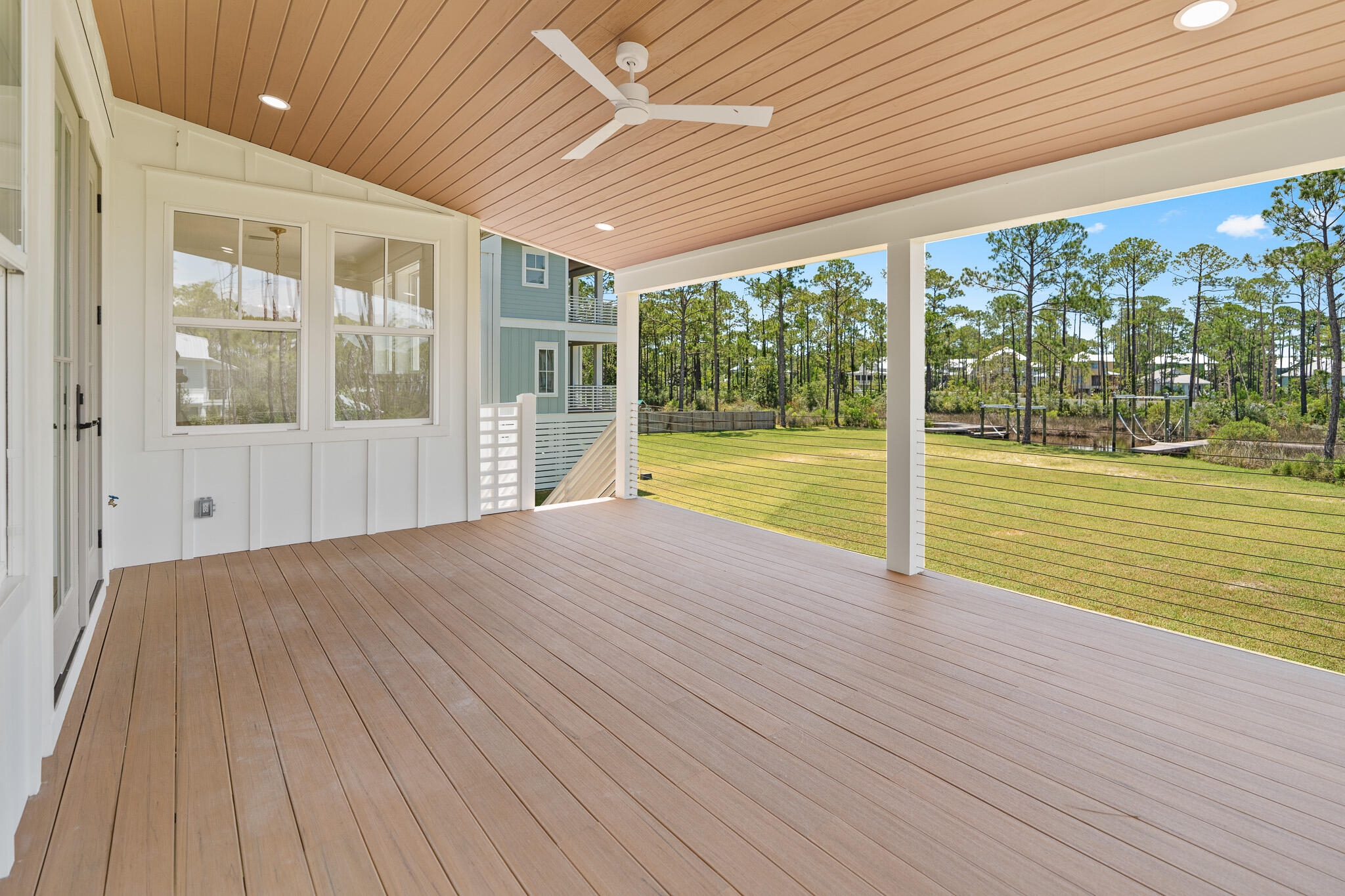 121 West Nursery Road Santa Rosa Beach, FL 32459 - Photo 58 of 66 a view of an empty room with wooden floor and a window