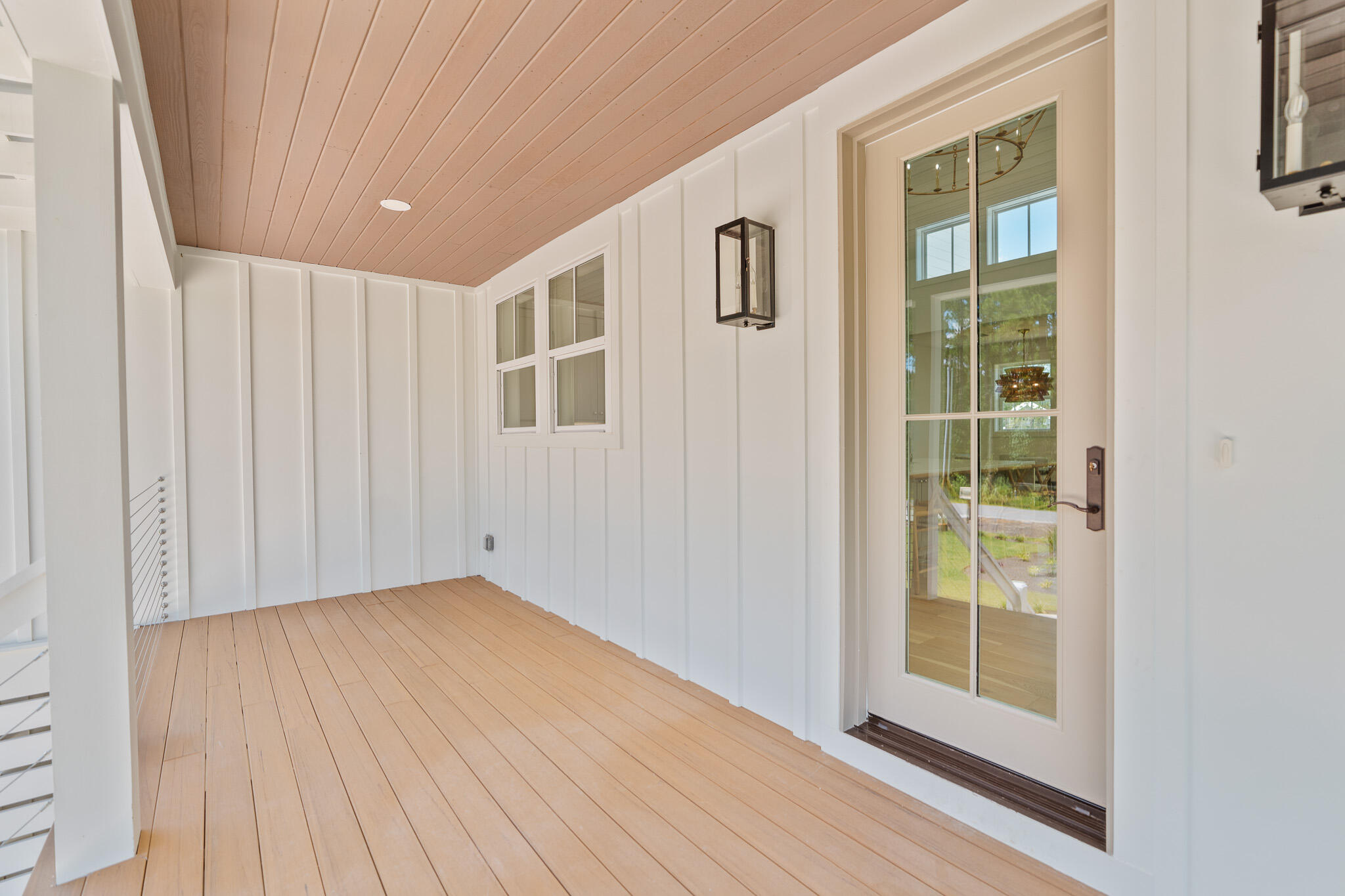 121 West Nursery Road Santa Rosa Beach, FL 32459 - Photo 65 of 66 a view of an empty room with a window and wooden floor