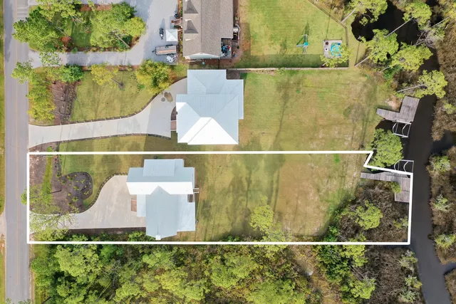 a view of a houses with trees