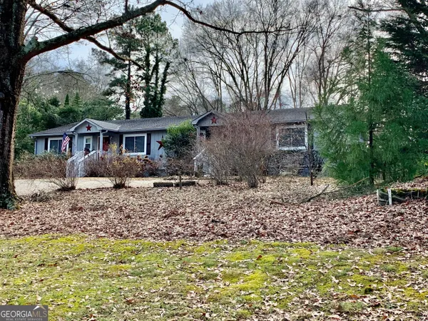a house with trees in the background