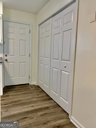 a view of a livingroom with wooden floor