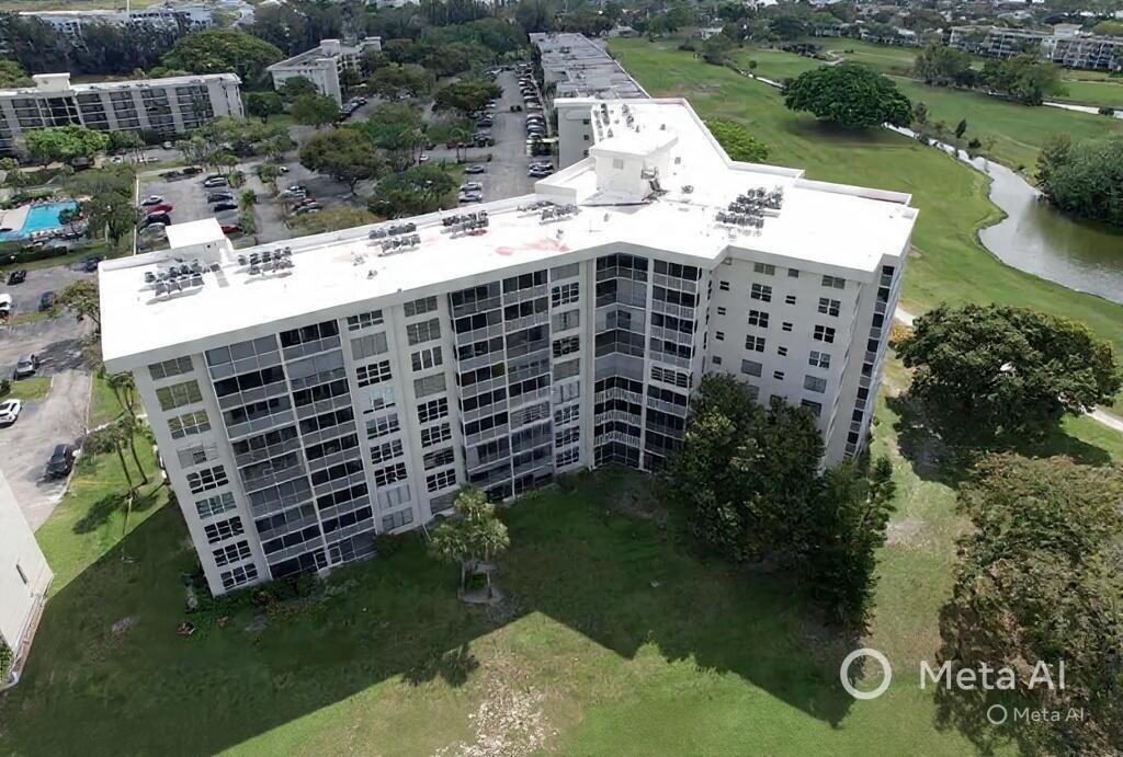 2681 South Course Drive, Unit 511 Pompano Beach, FL 33069 - Photo 1 of 35 a view of a backyard with plants and lake view
