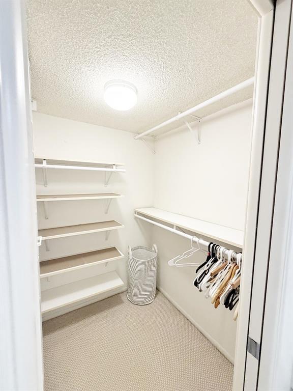 2681 South Course Drive, Unit 511 Pompano Beach, FL 33069 - Photo 16 of 35 a view of walk in closet with empty racks