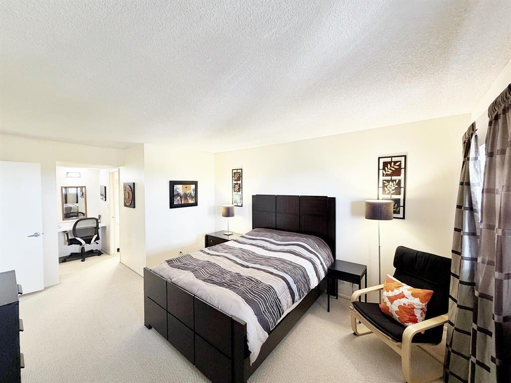 2681 South Course Drive, Unit 511 Pompano Beach, FL 33069 - Photo 19 of 35 a spacious bedroom with a bed and furniture