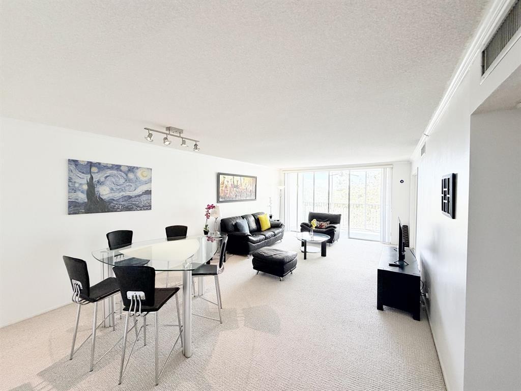2681 South Course Drive, Unit 511 Pompano Beach, FL 33069 - Photo 10 of 35 a living room with furniture and a couch