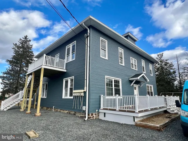 a front view of a house with a porch