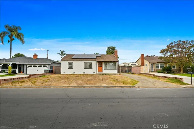 a view of a house with pool and chairs