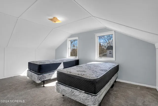 a living room with couch and window