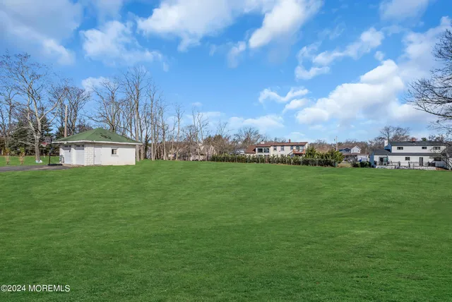 a view of a house with a big yard