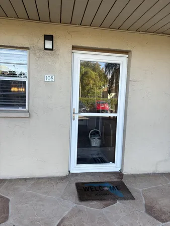 a living room with a fireplace and a rug