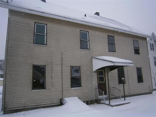 79 Parker Street Springfield, MA 01151 - Photo 3 of 9 a front view of a house with glass windows