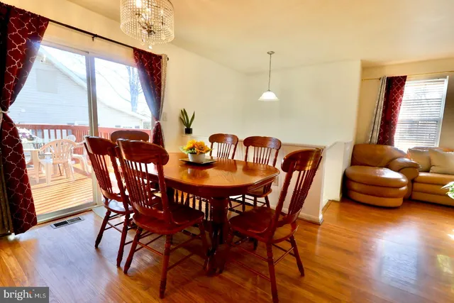 a dining room with furniture window wooden floor