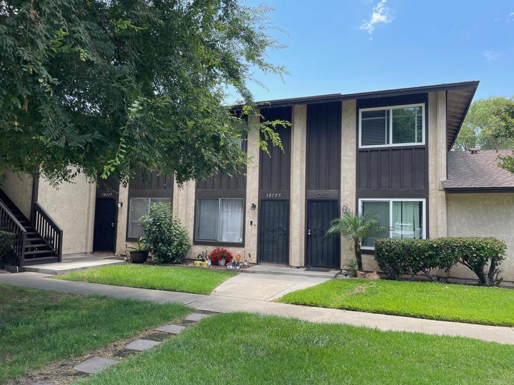 10135 Peaceful Court Santee, CA 92071 - Photo 1 of 1 a front view of a house with a yard and trees