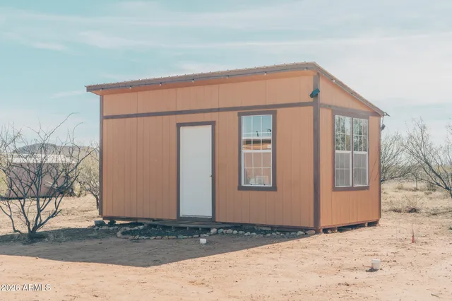 a bed room with a bed and a window