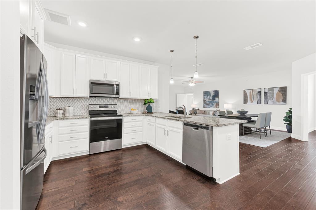 651 Watters Road, Unit 7406 Allen, TX 75013 - Photo 2 of 37 Plenty of counterspace, modern white cabinets and recessed lighting