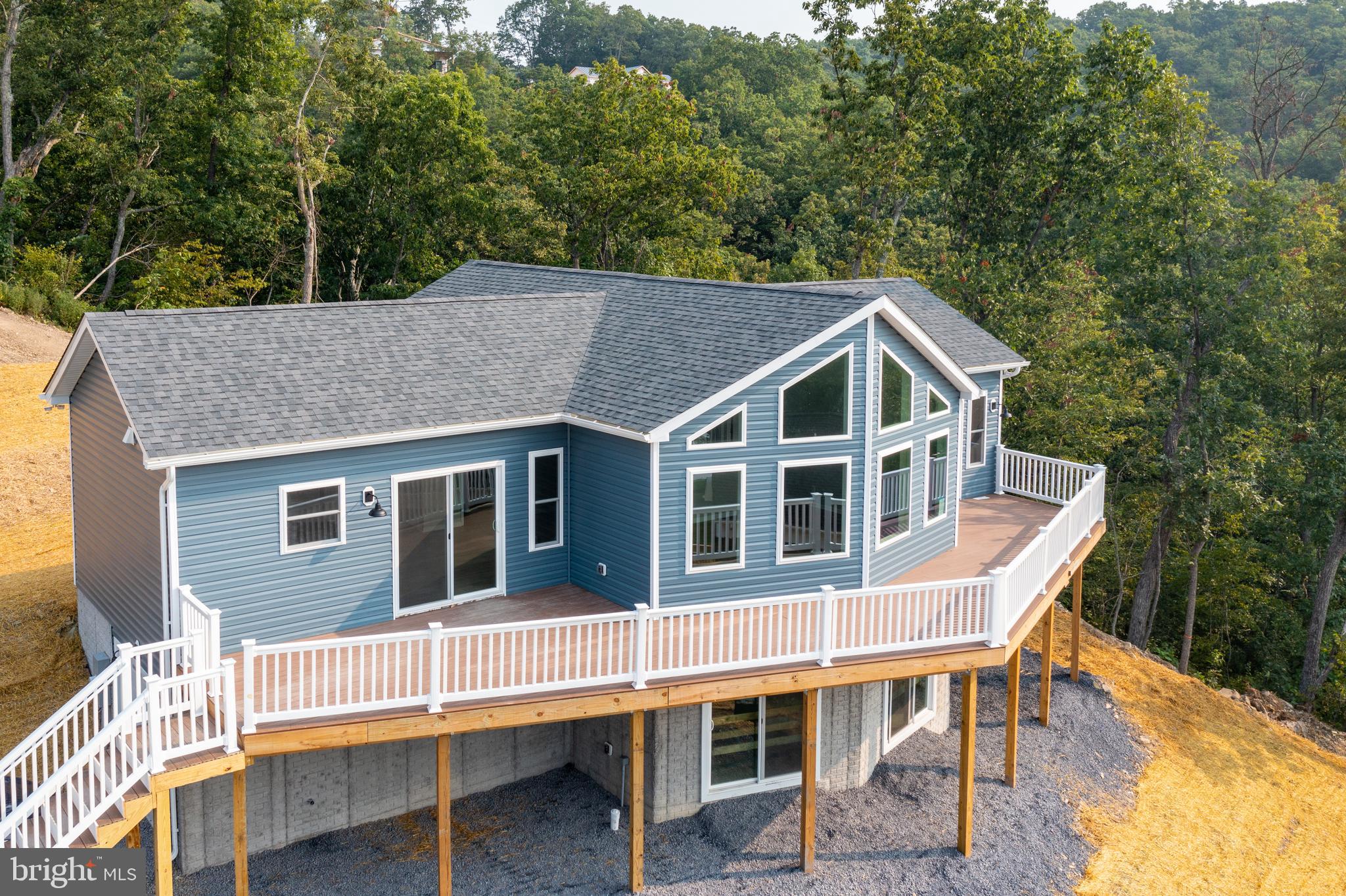 0 Gooney Manor Loop Bentonville, VA 22610 - Photo 1 of 17 a balcony with table and chairs