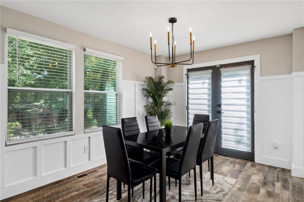 298 Roy Street Southwest Atlanta, GA 30310 - Photo 16 of 50 a view of a dining room with furniture window and wooden floor