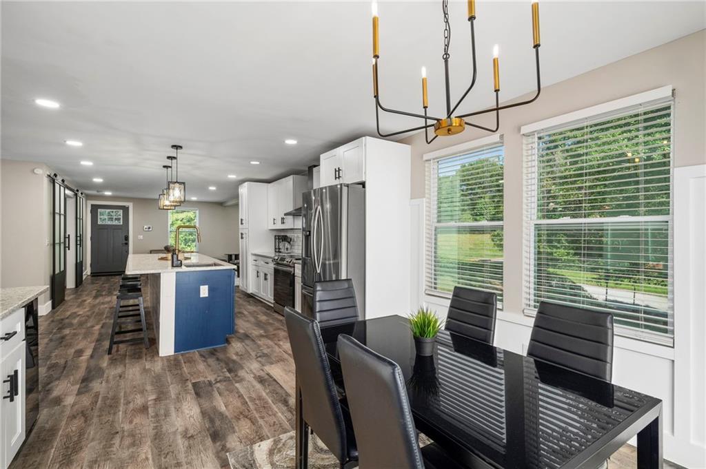 298 Roy Street Southwest Atlanta, GA 30310 - Photo 17 of 50 a living room with furniture and a flat screen tv