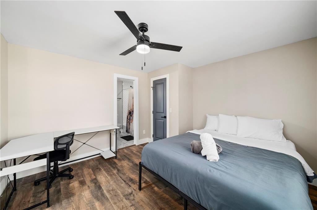 298 Roy Street Southwest Atlanta, GA 30310 - Photo 20 of 50 a bed room with a bed and a ceiling fan