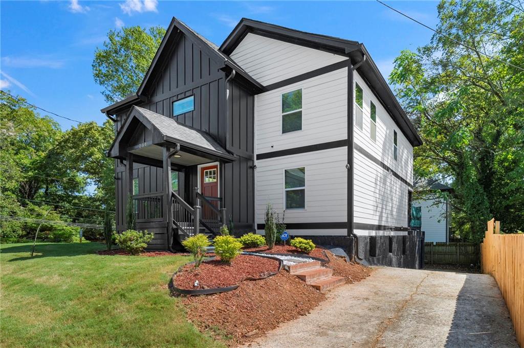 298 Roy Street Southwest Atlanta, GA 30310 - Photo 2 of 50 a front view of a house with garden