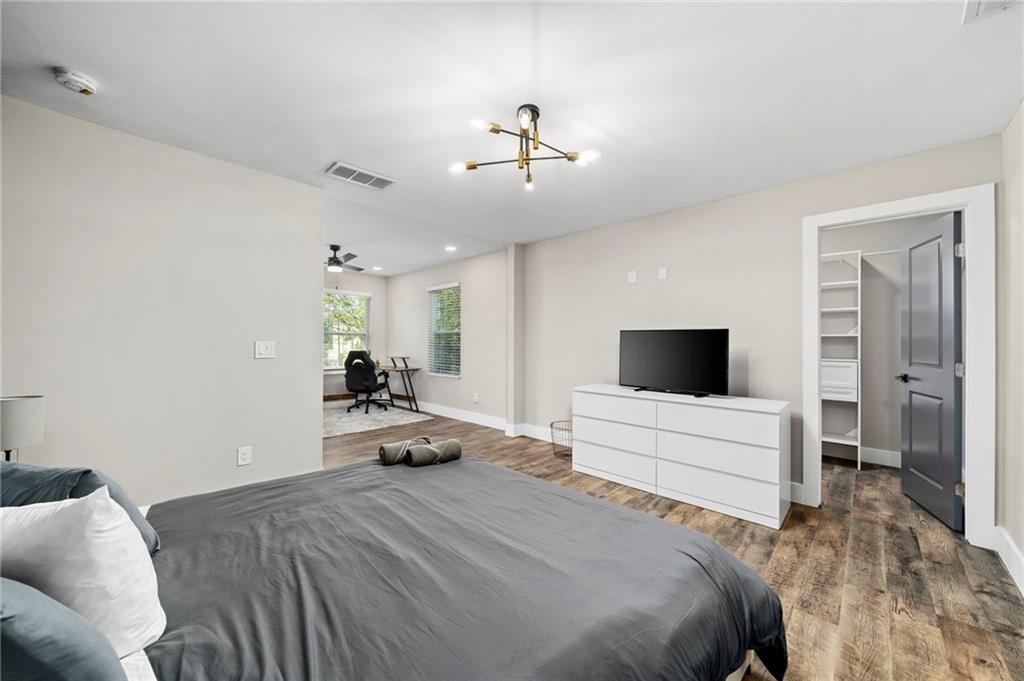 298 Roy Street Southwest Atlanta, GA 30310 - Photo 26 of 50 a bedroom with a bed and a flat screen tv