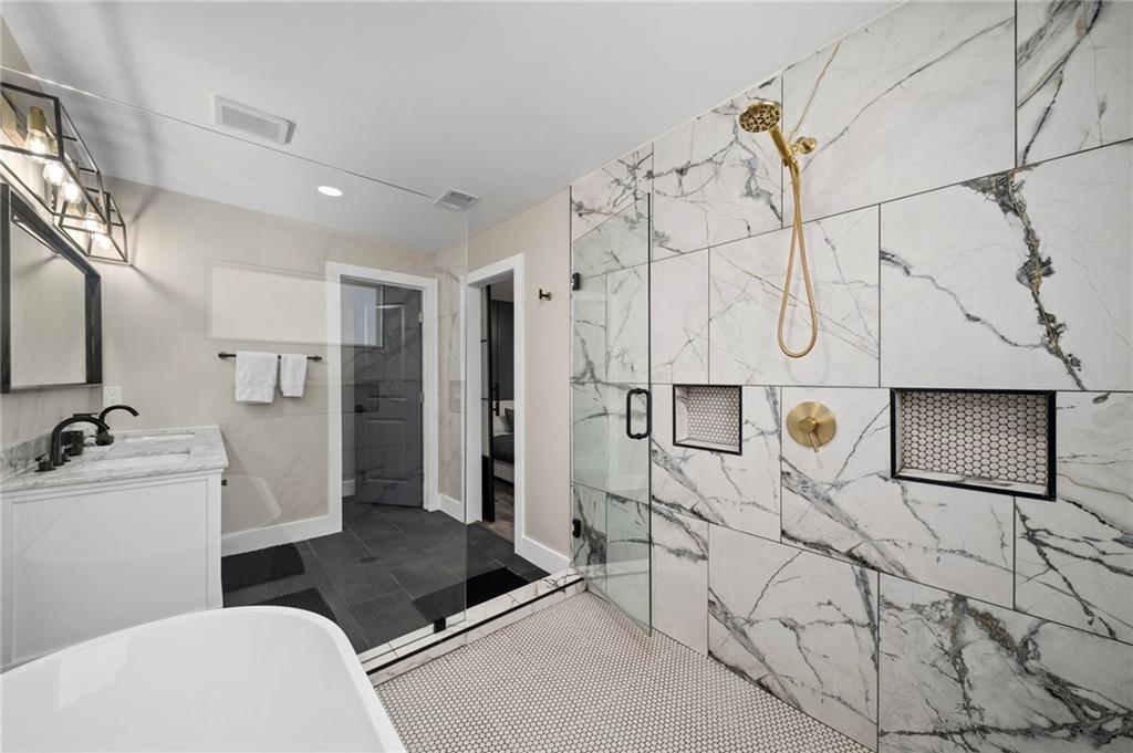 298 Roy Street Southwest Atlanta, GA 30310 - Photo 32 of 50 a bathroom with a sink a toilet and shower