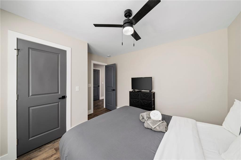 298 Roy Street Southwest Atlanta, GA 30310 - Photo 35 of 50 a bedroom with a bed and a tv