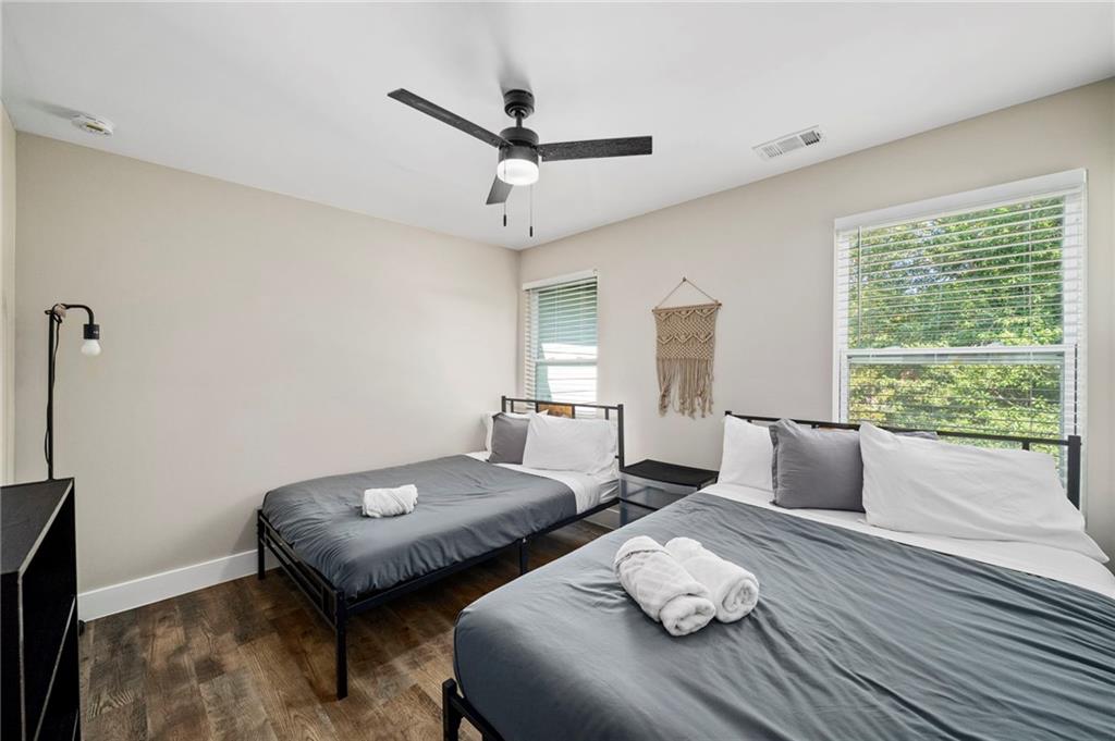 298 Roy Street Southwest Atlanta, GA 30310 - Photo 36 of 50 a bedroom with two beds and a large window