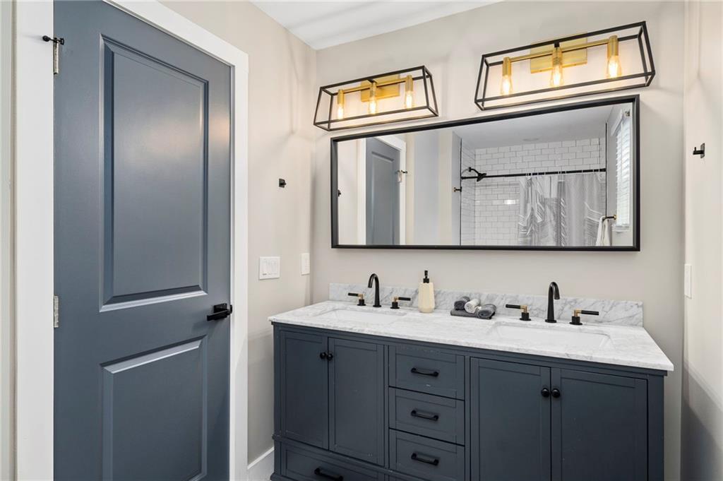 298 Roy Street Southwest Atlanta, GA 30310 - Photo 38 of 50 a bathroom with 2 sink and a mirror