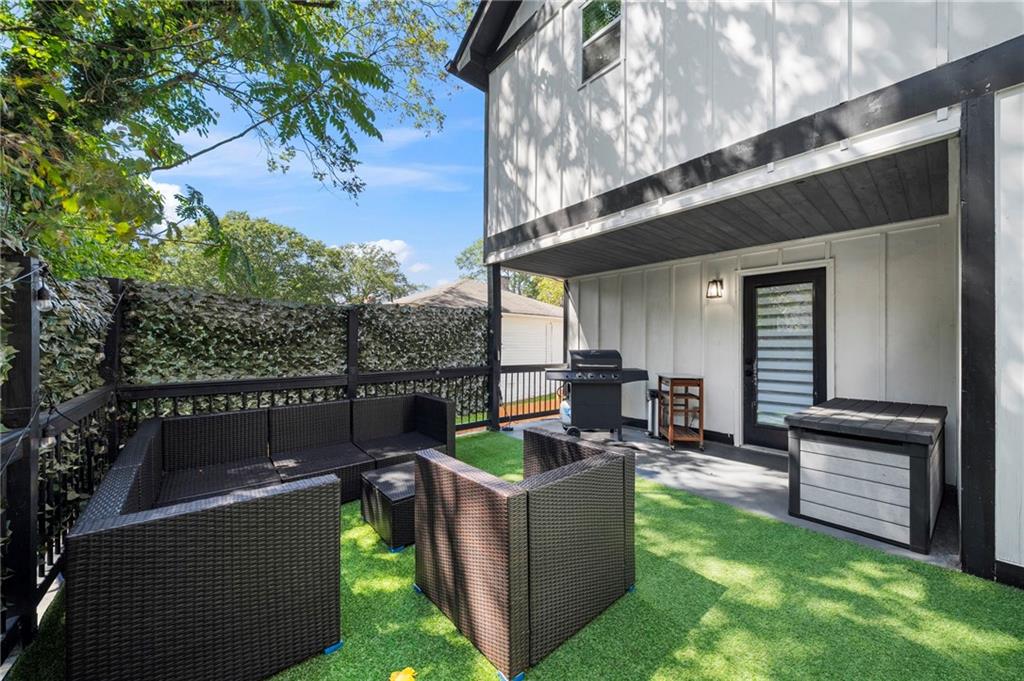 298 Roy Street Southwest Atlanta, GA 30310 - Photo 44 of 50 a view of a couches in the patio with a small yard