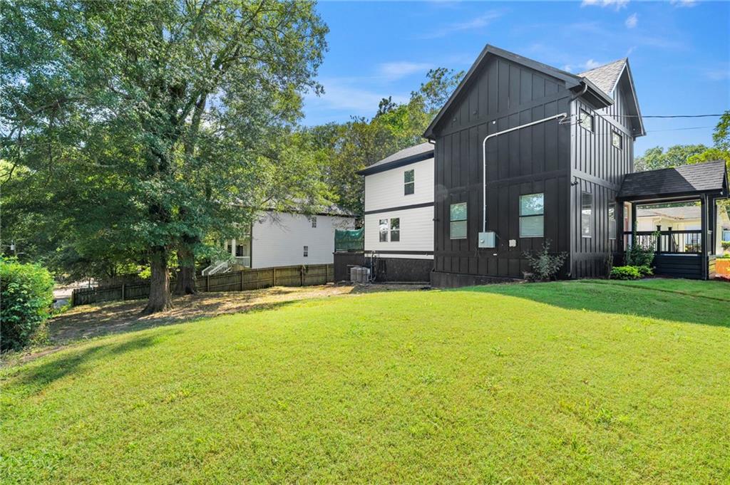298 Roy Street Southwest Atlanta, GA 30310 - Photo 46 of 50 a view of a house with a yard