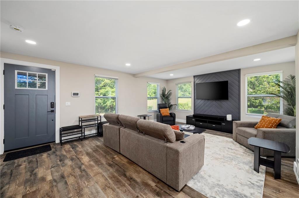 298 Roy Street Southwest Atlanta, GA 30310 - Photo 6 of 50 a living room with furniture and a flat screen tv