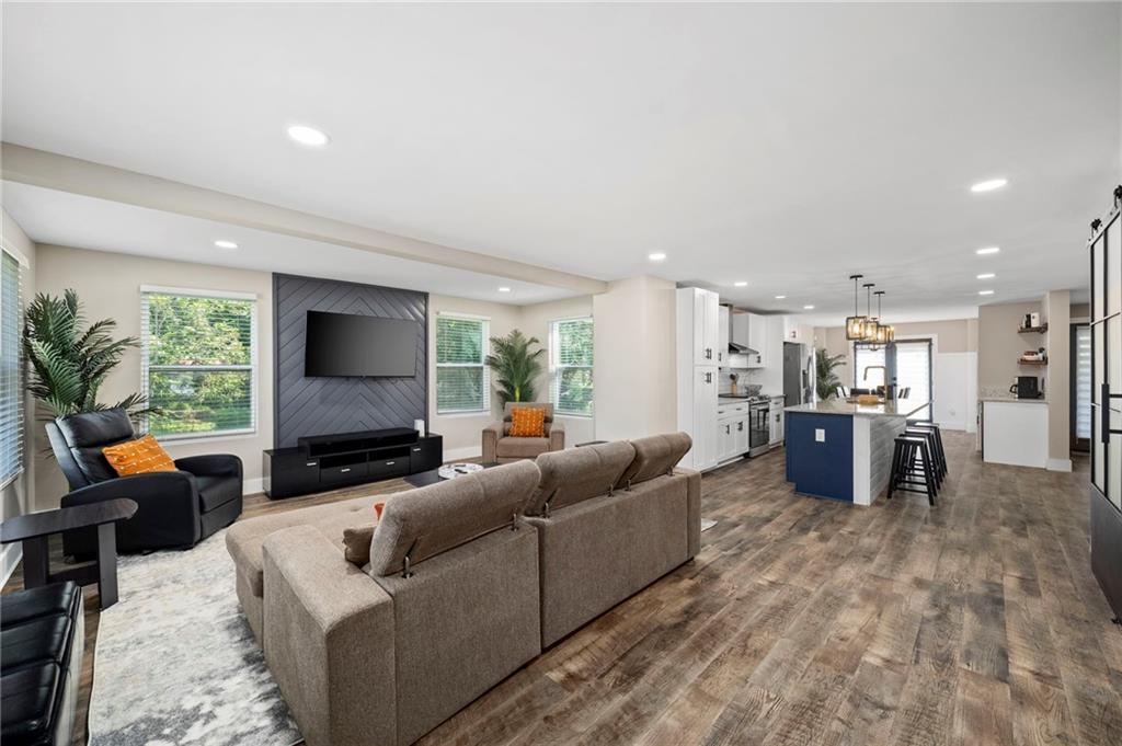 298 Roy Street Southwest Atlanta, GA 30310 - Photo 7 of 50 a living room with furniture and a flat screen tv