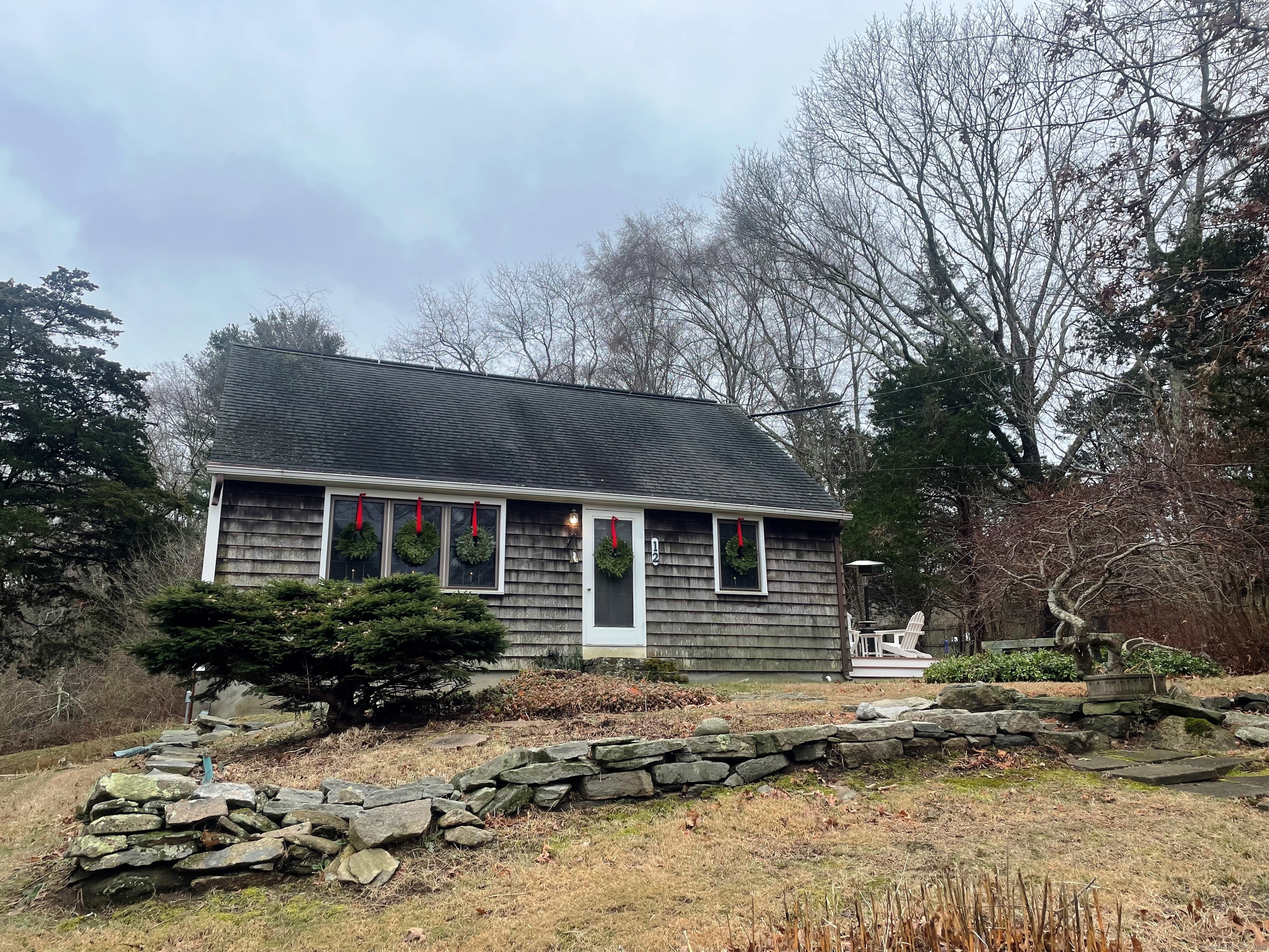 12 Little Gull Lane Groton, CT 06355 - Photo 1 of 25 front view of a house with a yard