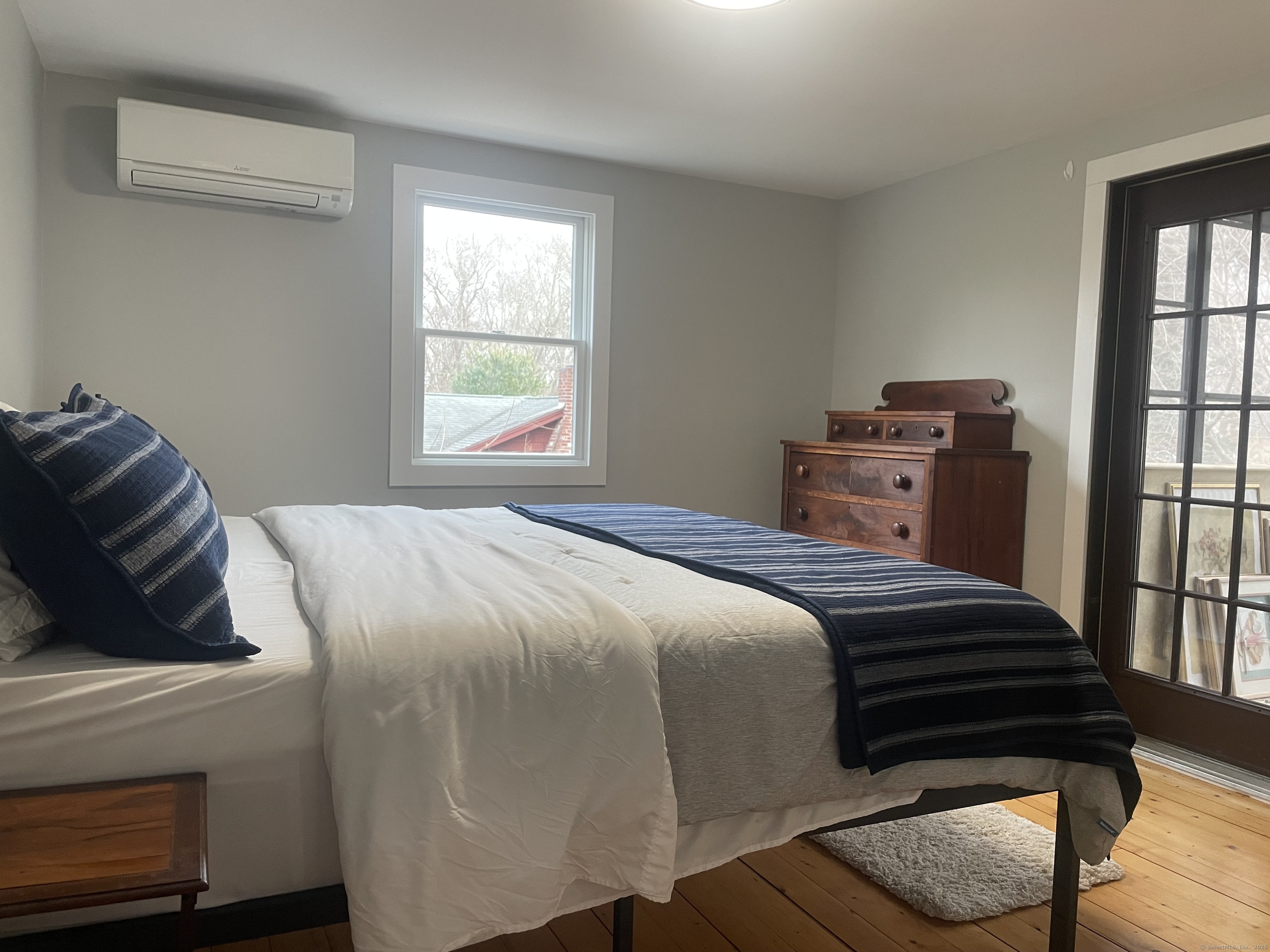 12 Little Gull Lane Groton, CT 06355 - Photo 12 of 25 a bedroom with a bed and window