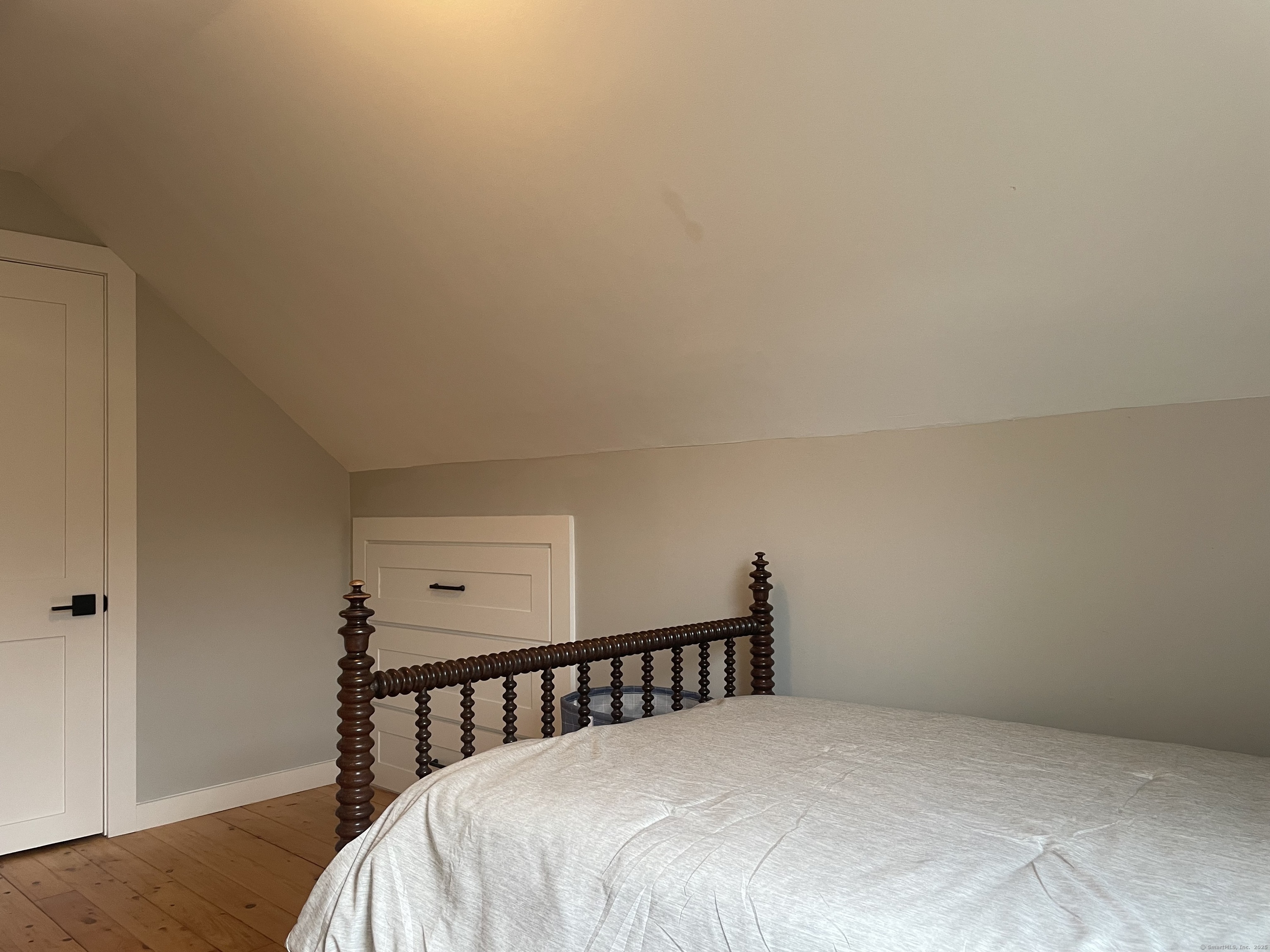 12 Little Gull Lane Groton, CT 06355 - Photo 13 of 25 a bed sitting in a bedroom next to a window