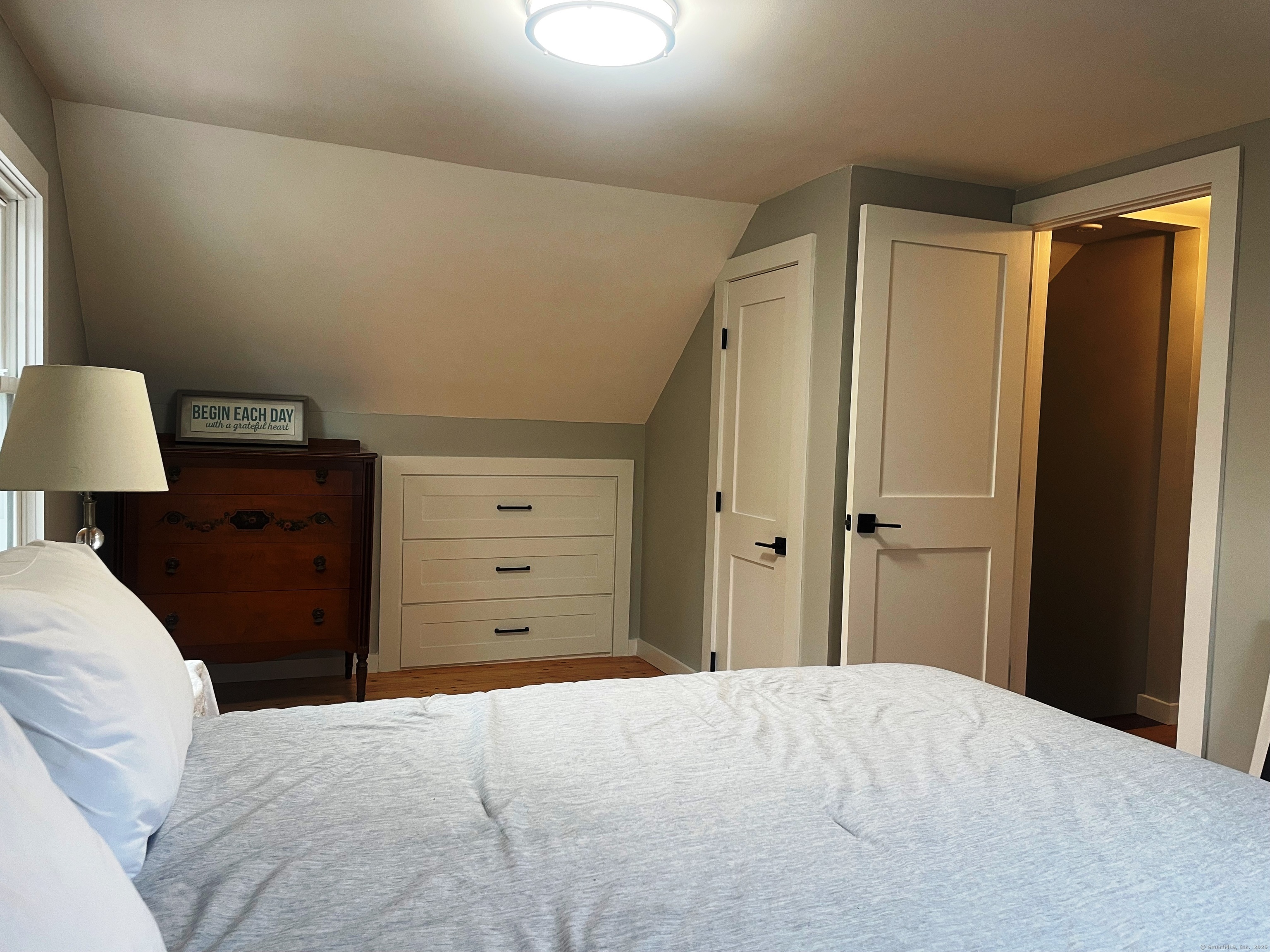 12 Little Gull Lane Groton, CT 06355 - Photo 17 of 25 a bedroom with a bed and a dresser