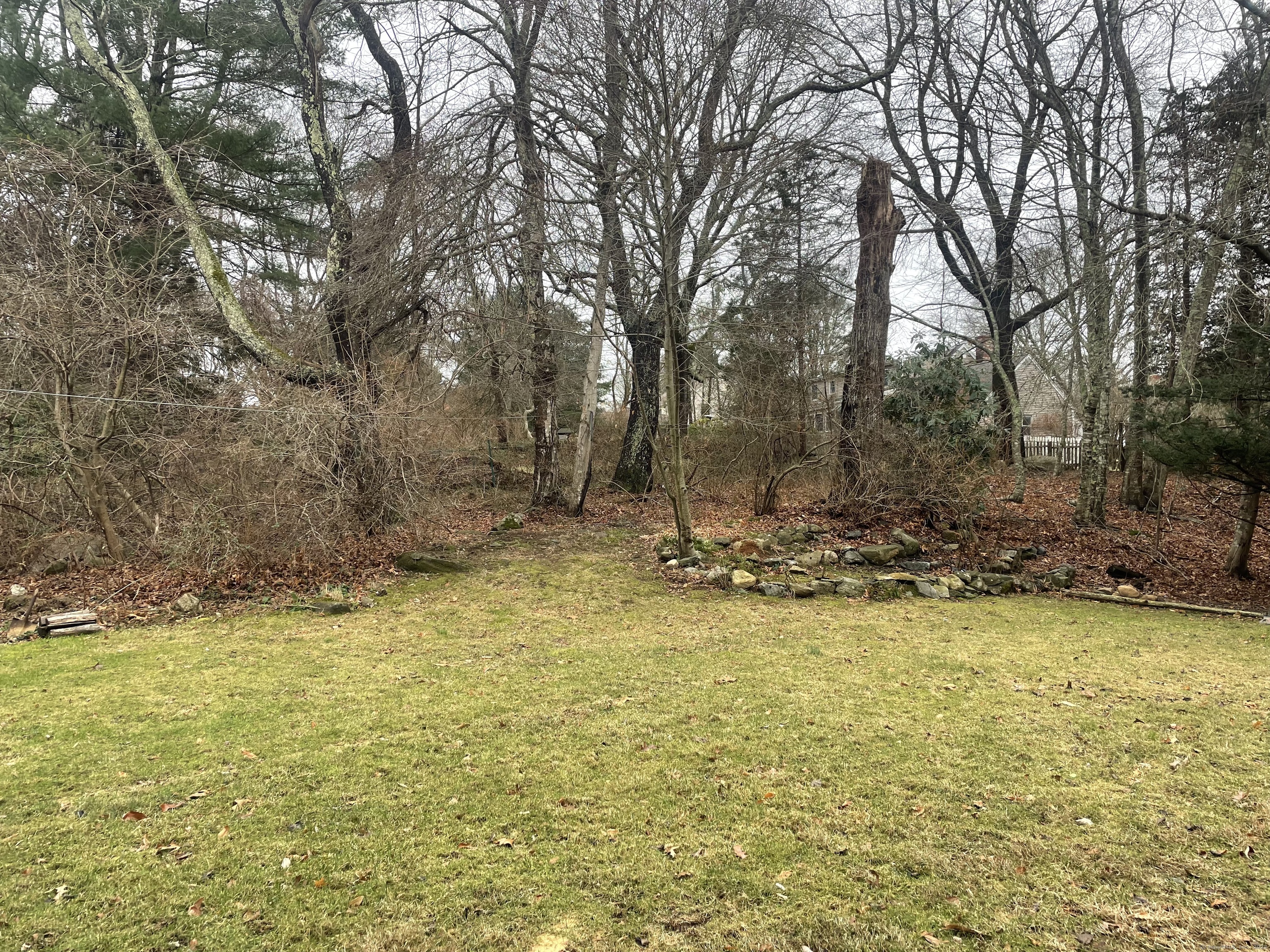 12 Little Gull Lane Groton, CT 06355 - Photo 3 of 25 a view of a pool with trees in the background