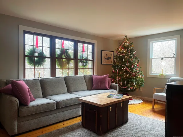 a living room with furniture and a large window