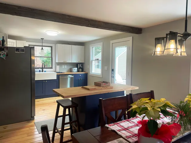 a kitchen with a table and chairs in it
