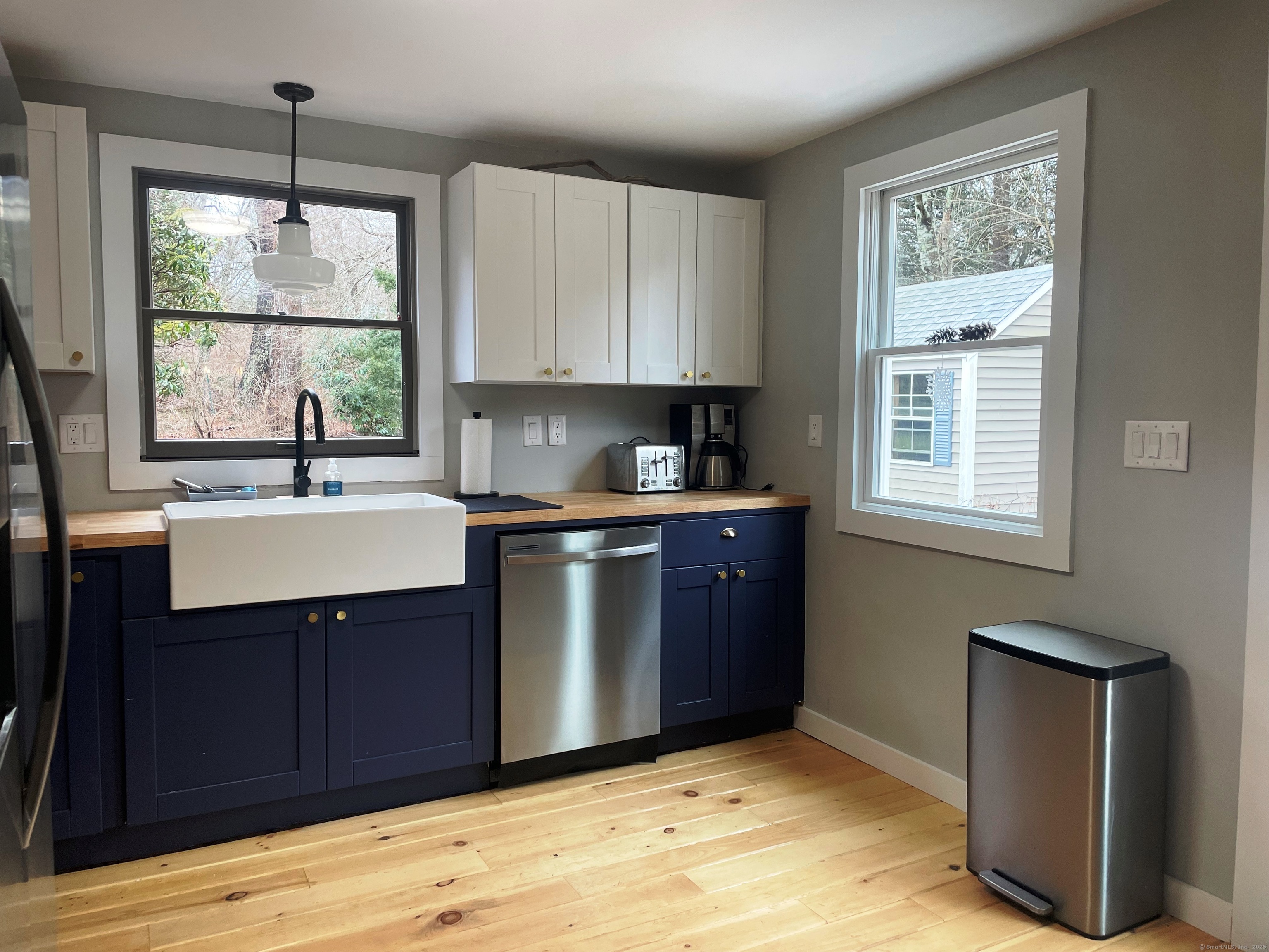 12 Little Gull Lane Groton, CT 06355 - Photo 10 of 25 a kitchen with a sink window and cabinets