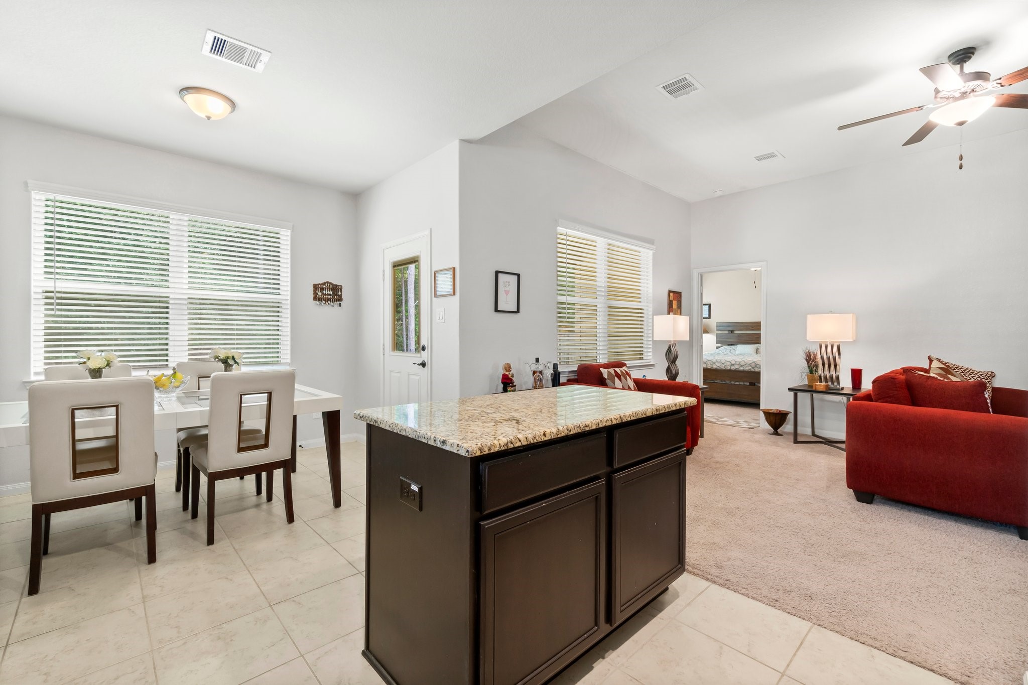 7643 Glaber Leaf Road Conroe, TX 77304 - Photo 7 of 26 Such an open space and tons of windows to bring in that natural light and amazing greenbelt view.