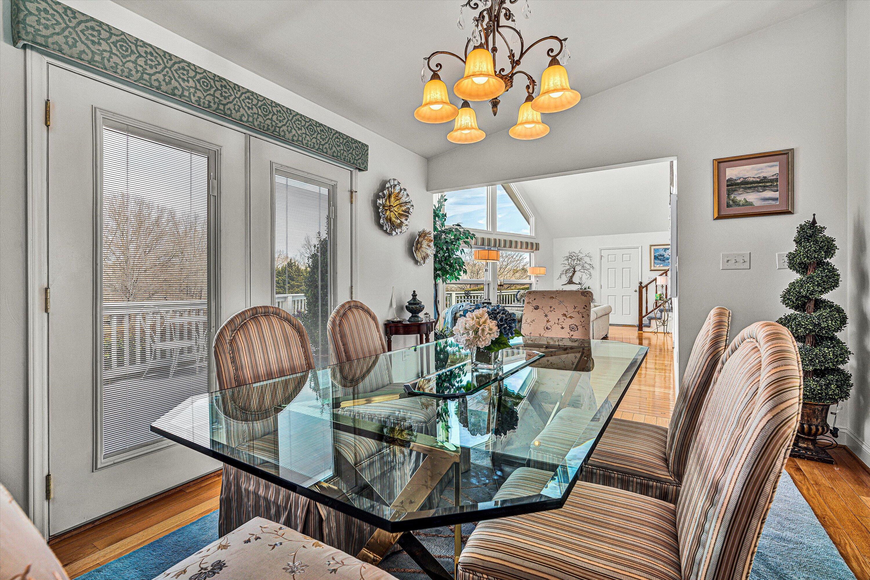 540 Cedar Ridge Road Union Hall, VA 24176 - Photo 12 of 46 a view of a dining room with furniture a livingroom and chandelier